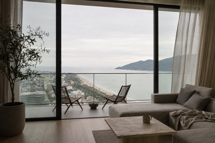 The living room of a high floor sea view apartment in Da Nang looking along My Khe beach