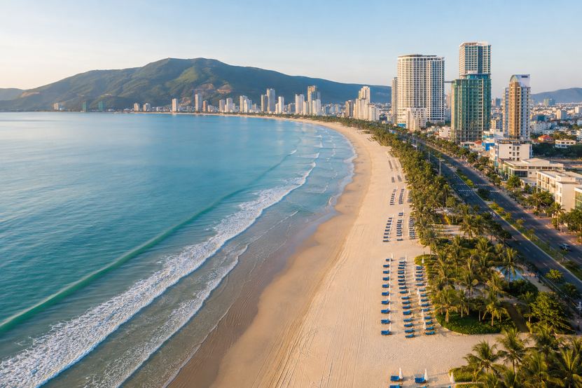 Aerial view of My Khe beach in Da Nang curving north toward the Son Tra peninsula